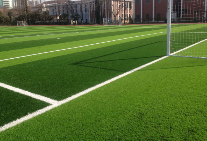 How does the artificial turf stick to the concrete floor?